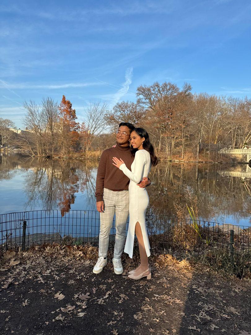 couple by lake smiling