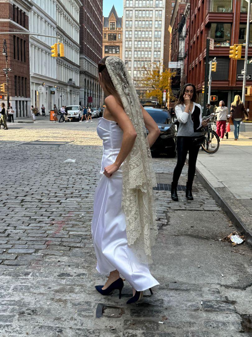 Bride crossing the street.