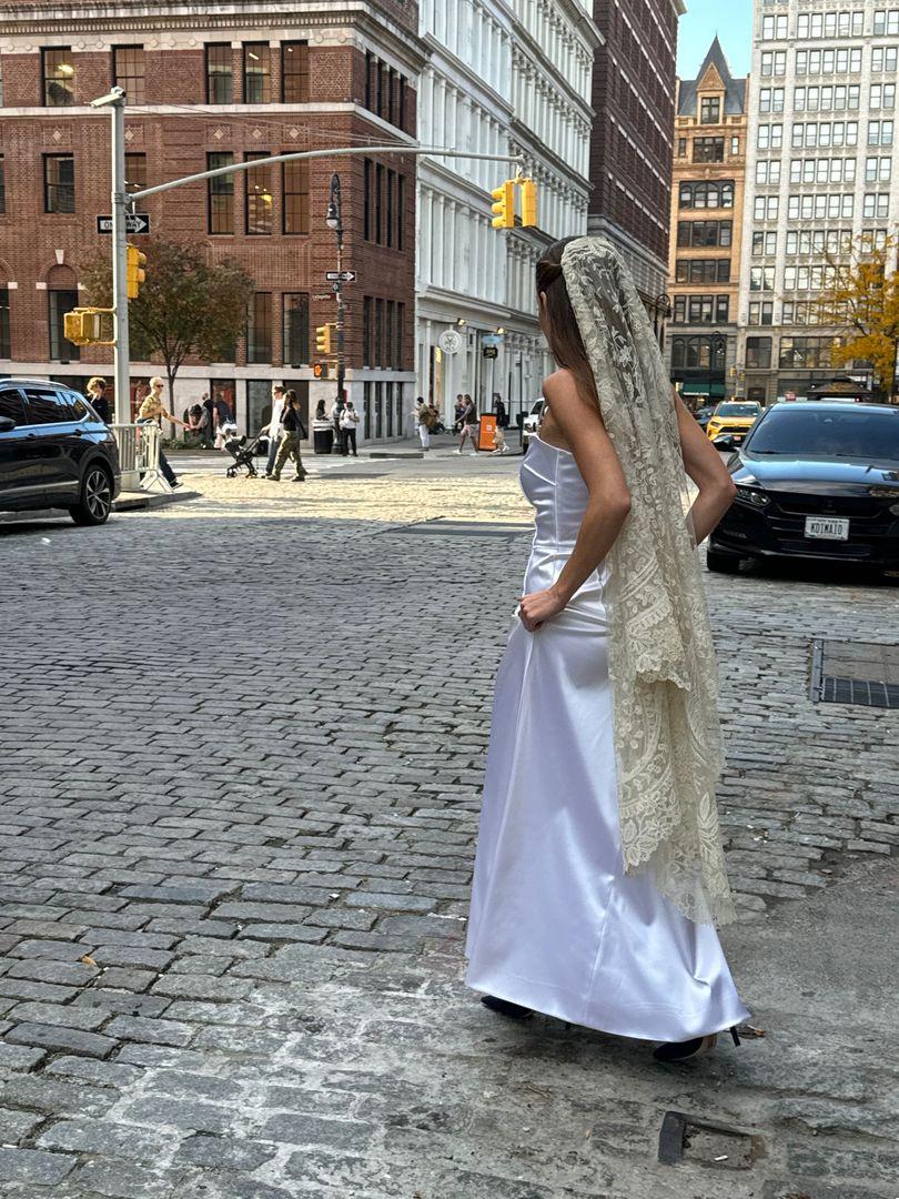 Bride crossing the street.