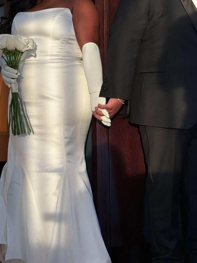 Bride and groom holding hands.